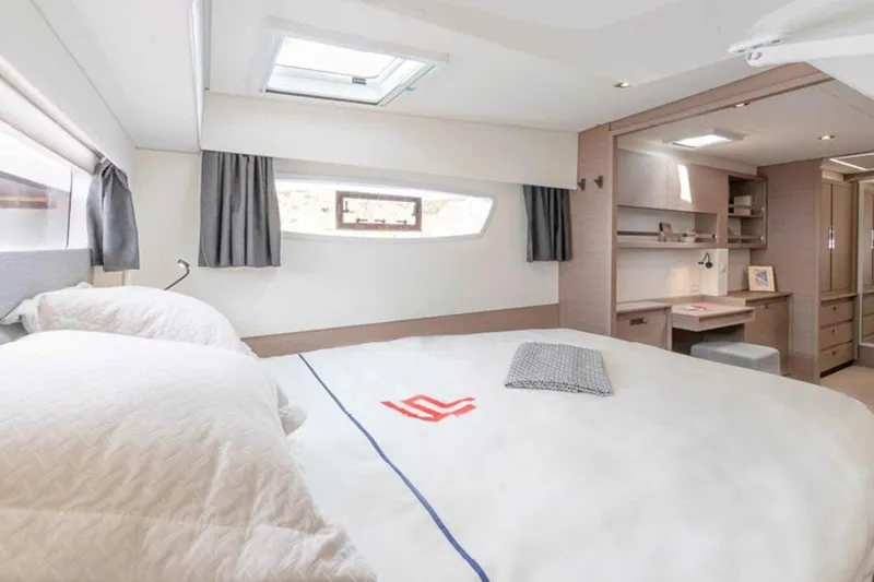  Yacht Photos Pics Luxurious cabin interior of 2025 Fountaine Pajot Elba 45 catamaran, featuring elegant design and ample natural light.