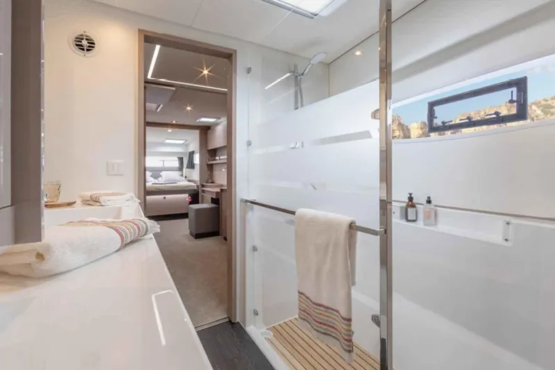  Yacht Photos Pics Luxurious bathroom interior of 2025 Fountaine Pajot Elba 45 yacht, featuring modern design and amenities.