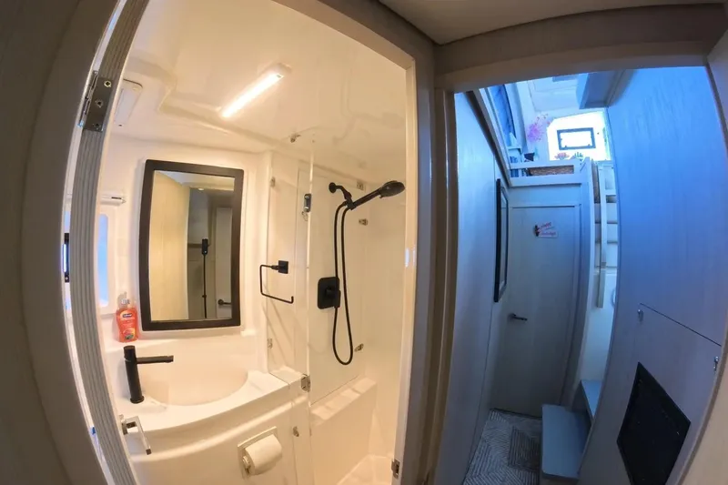 Somewhere Hot Yacht Photos Pics Bathroom interior of 2014 Leopard 51 Powercat yacht, featuring modern fixtures and shower.