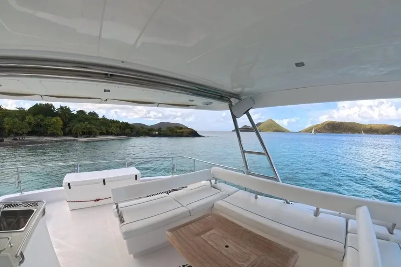 Somewhere Hot Yacht Photos Pics Leopard 51 Powercat 2014 yacht with ocean view and tropical island backdrop.