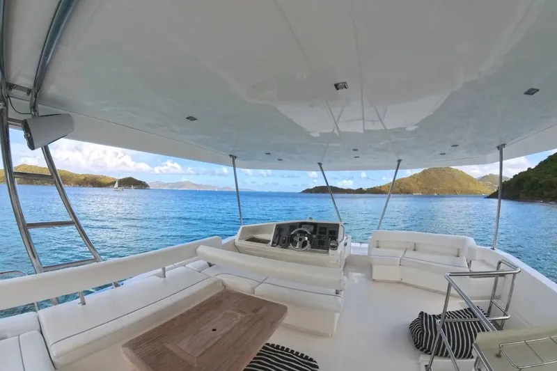 Somewhere Hot Yacht Photos Pics Luxurious 2014 Leopard 51 Powercat yacht interior with ocean view and comfortable seating.