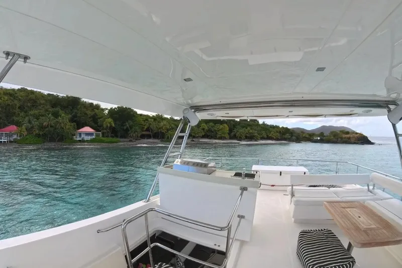 Somewhere Hot Yacht Photos Pics Luxurious 2014 Leopard 51 Powercat yacht with scenic tropical island view.