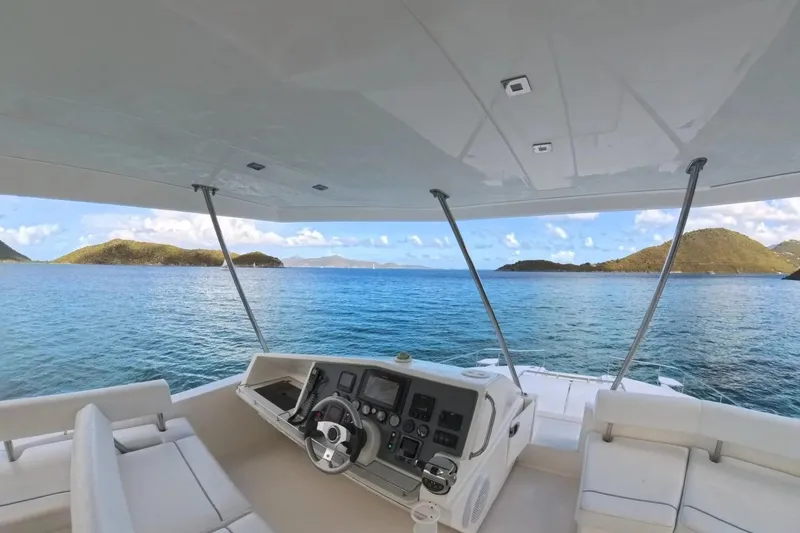 Somewhere Hot Yacht Photos Pics Leopard 51 Powercat 2014 yacht interior with ocean view and island backdrop.