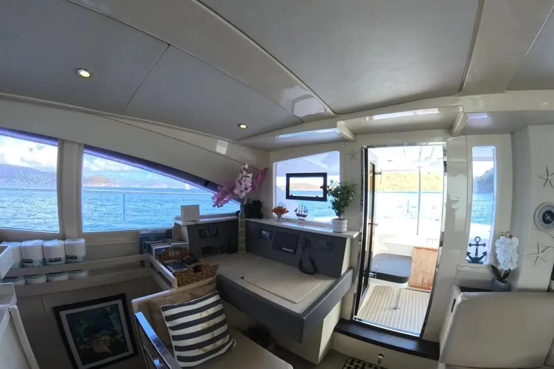 Somewhere Hot Yacht Photos Pics Luxurious interior of 2014 Leopard 51 Powercat yacht with ocean view.