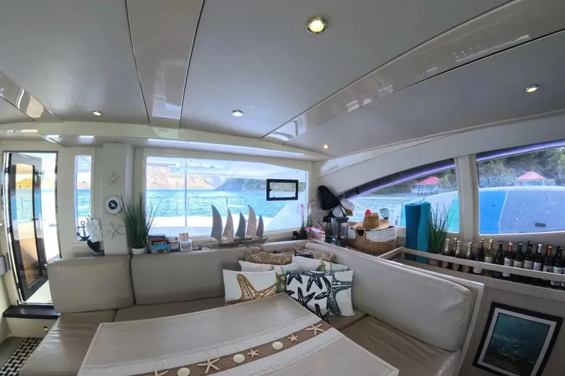 Somewhere Hot Yacht Photos Pics Luxurious interior of 2014 Leopard 51 Powercat yacht with scenic ocean view.