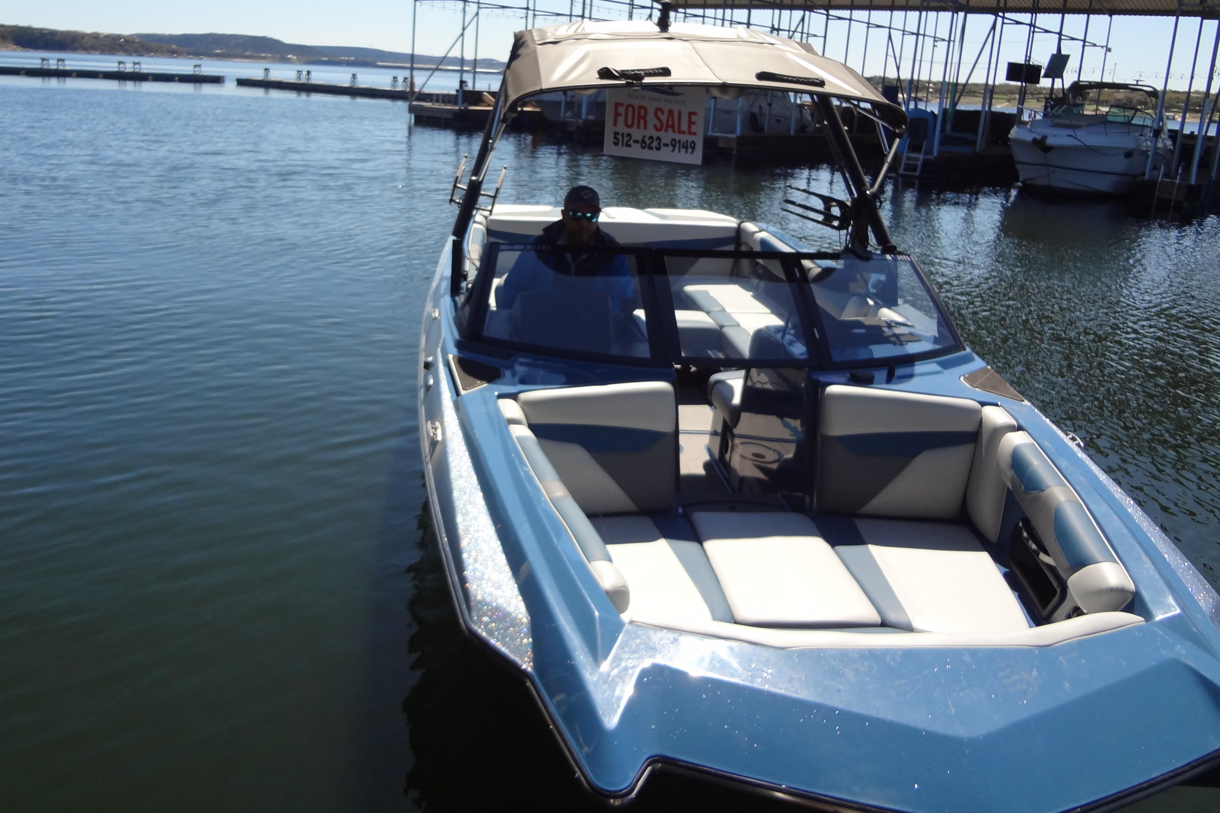 2021 Axis A24 boat for sale, docked on a sunny day.