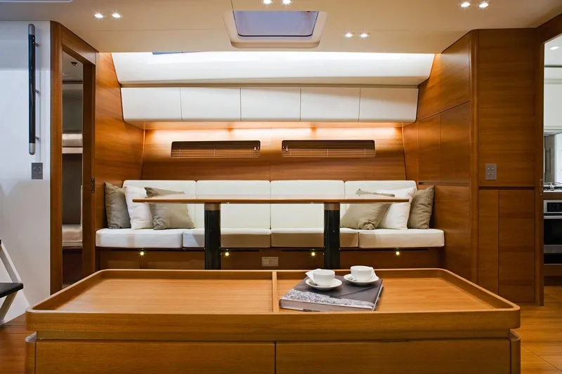 Dark Horse Yacht Photos Pics Luxurious interior of 2013 Nautor Swan 80 FD yacht with elegant wood finish.