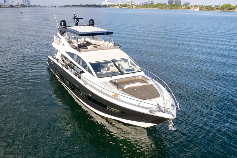  Yacht Photos Pics Luxurious 2020 Pearl 80 yacht cruising on calm blue waters.