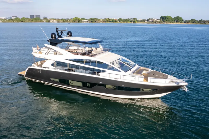  Yacht Photos Pics Luxurious 2020 Pearl 80 yacht cruising on serene blue waters.