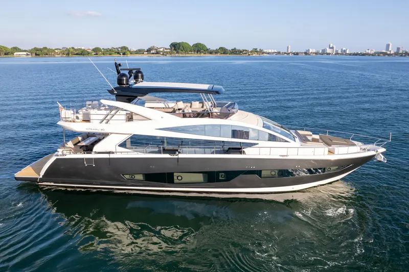  Yacht Photos Pics Luxurious 2020 Pearl 80 yacht cruising on serene blue waters.