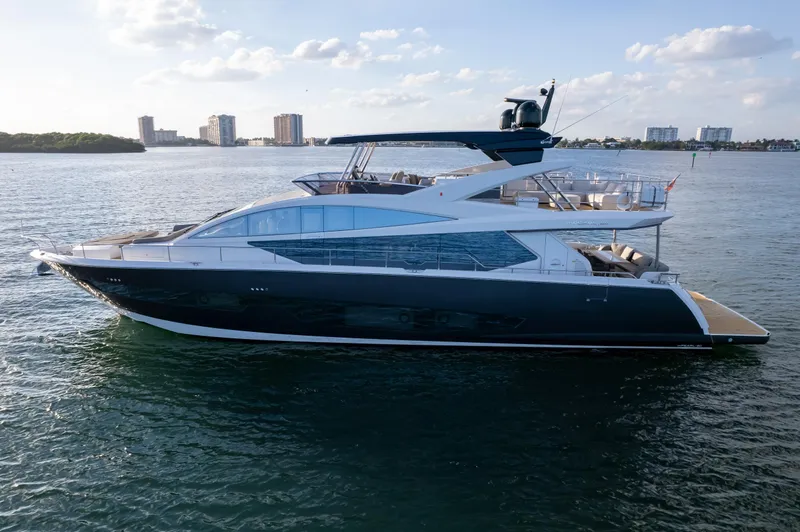  Yacht Photos Pics Luxurious 2020 Pearl 80 yacht cruising on calm waters under a clear sky.