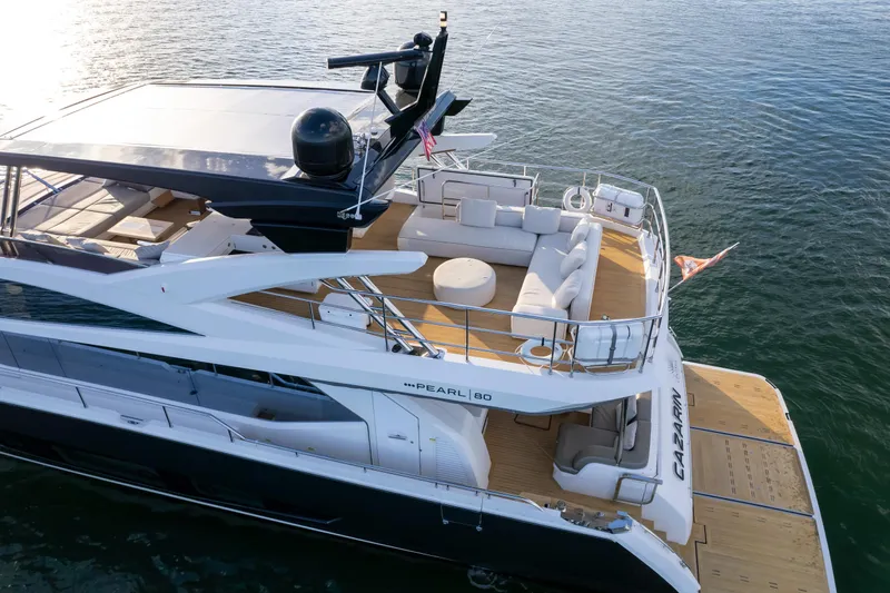  Yacht Photos Pics Luxurious 2020 Pearl 80 yacht with spacious deck and modern design on calm waters.
