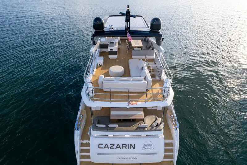  Yacht Photos Pics Luxurious 2020 Pearl 80 yacht on water, featuring spacious deck and elegant seating.