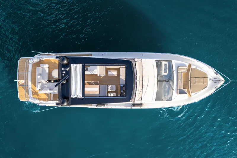  Yacht Photos Pics Aerial view of 2020 Pearl 80 yacht on clear blue water.