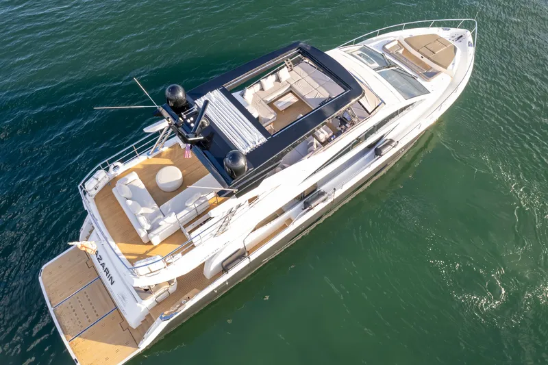  Yacht Photos Pics Luxurious 2020 Pearl 80 yacht cruising on clear blue water.