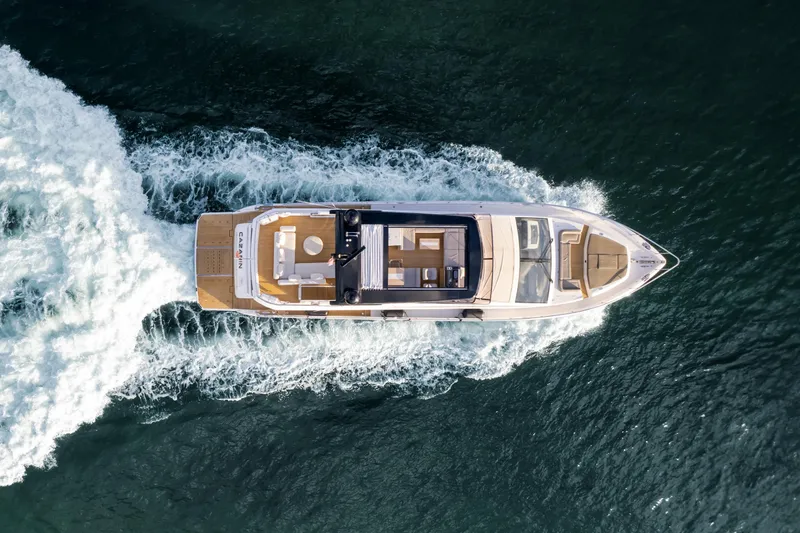  Yacht Photos Pics Aerial view of 2020 Pearl 80 yacht cruising on open water.