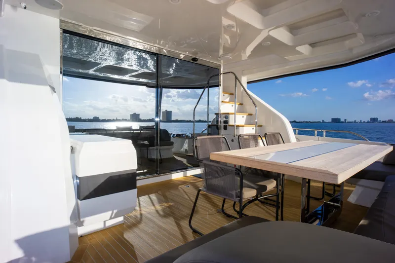  Yacht Photos Pics Luxurious Pearl 80 yacht interior with dining area, overlooking serene ocean view, 2020 model.