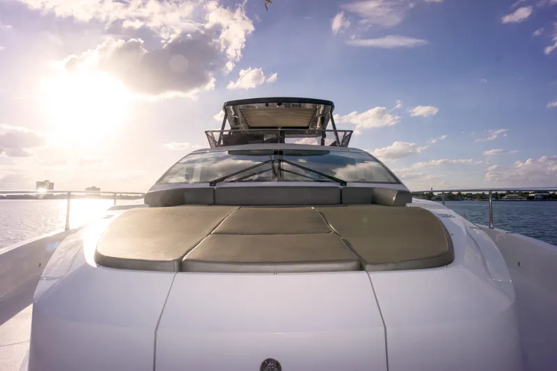  Yacht Photos Pics Luxurious 2020 Pearl 80 yacht on water at sunset, showcasing sleek design.