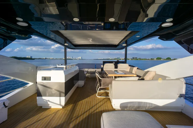  Yacht Photos Pics Luxurious Pearl 80 yacht deck with seating, ocean view, and modern design, 2020 model.