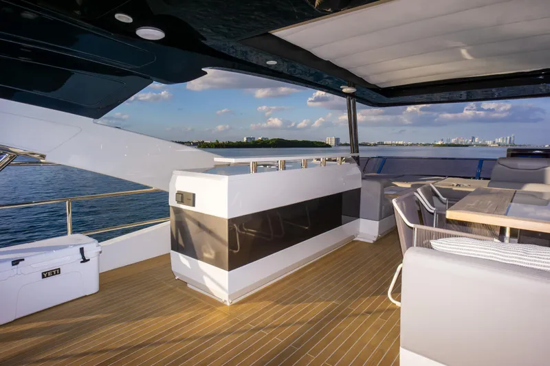  Yacht Photos Pics Luxurious Pearl 80 yacht deck with seating, ocean view, and modern design, 2020 model.