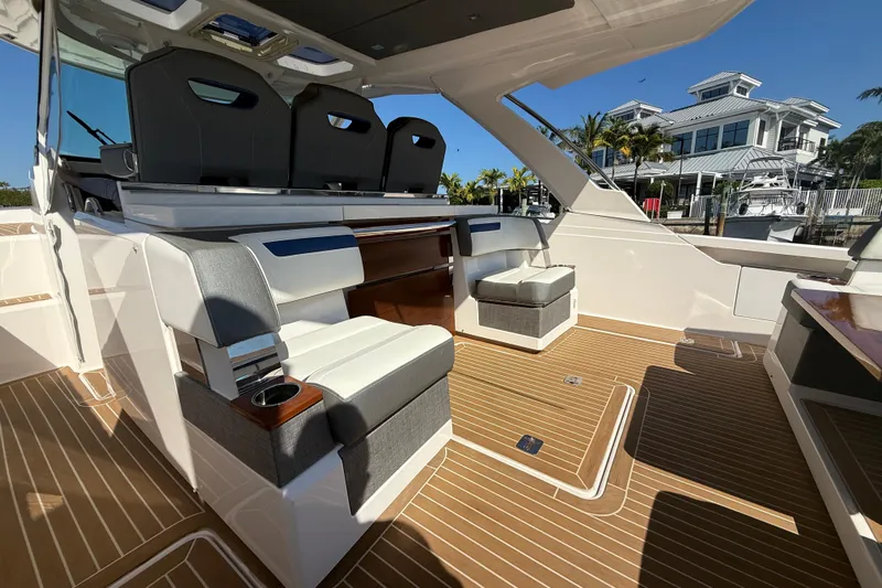  Yacht Photos Pics 2019 Tiara Sport 38 LS boat interior with luxurious seating and teak flooring.