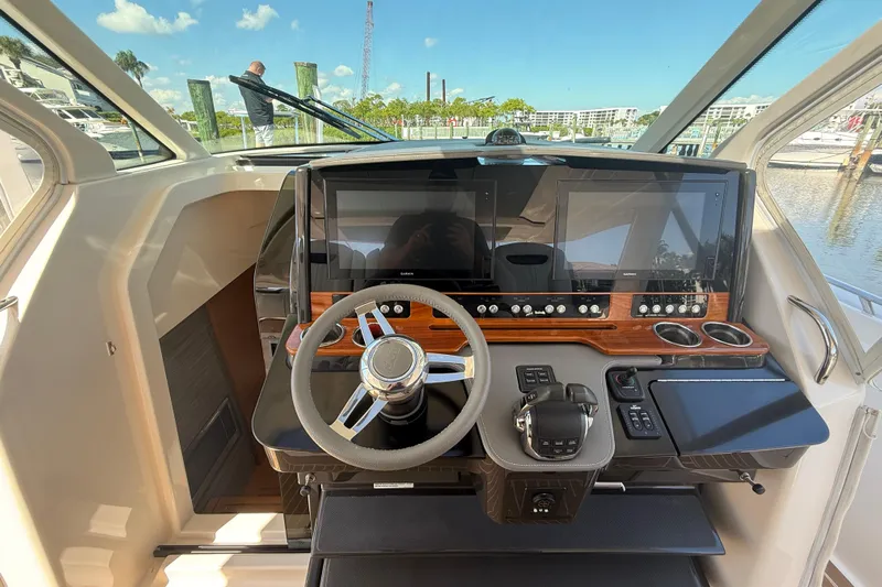  Yacht Photos Pics 2019 Tiara Sport 38 LS helm with modern controls and dual displays, dockside view.