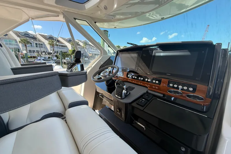  Yacht Photos Pics Interior of 2019 Tiara Sport 38 LS boat with modern dashboard and steering wheel.