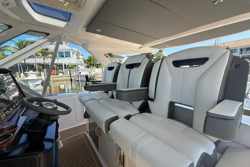  Yacht Photos Pics 2019 Tiara Sport 38 LS boat interior with luxurious seating and modern helm.