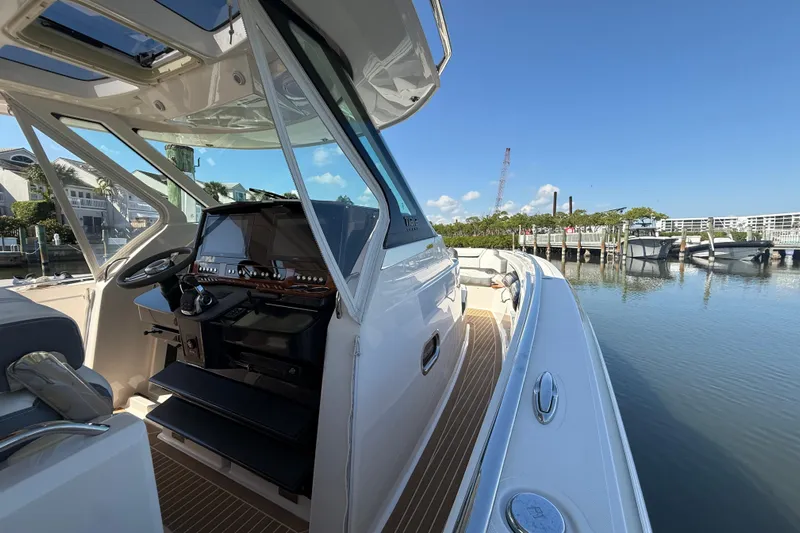  Yacht Photos Pics 2019 Tiara Sport 38 LS boat docked, showcasing helm and sleek design.