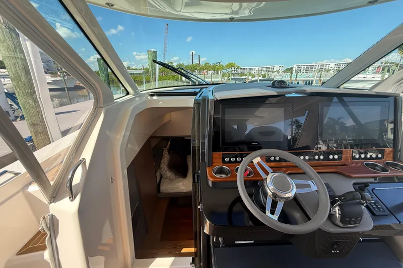  Yacht Photos Pics 2019 Tiara Sport 38 LS boat helm with modern controls and navigation screens.