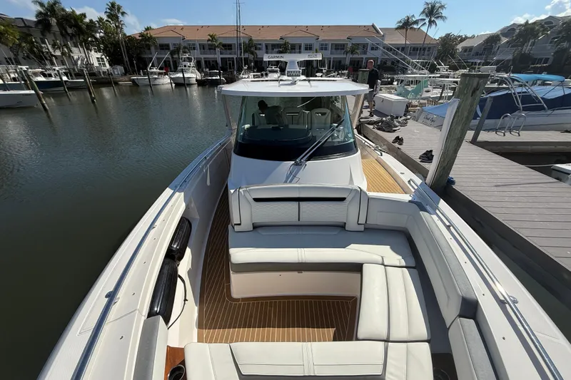  Yacht Photos Pics 2019 Tiara Sport 38 LS boat docked at marina with luxurious seating.