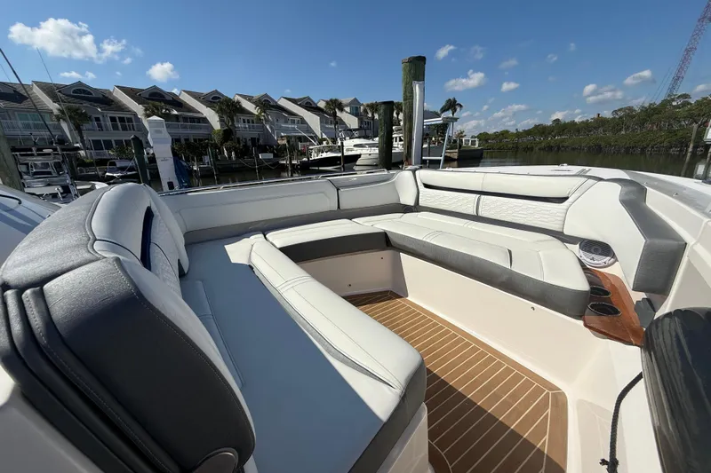  Yacht Photos Pics 2019 Tiara Sport 38 LS boat with luxurious seating and waterfront view.