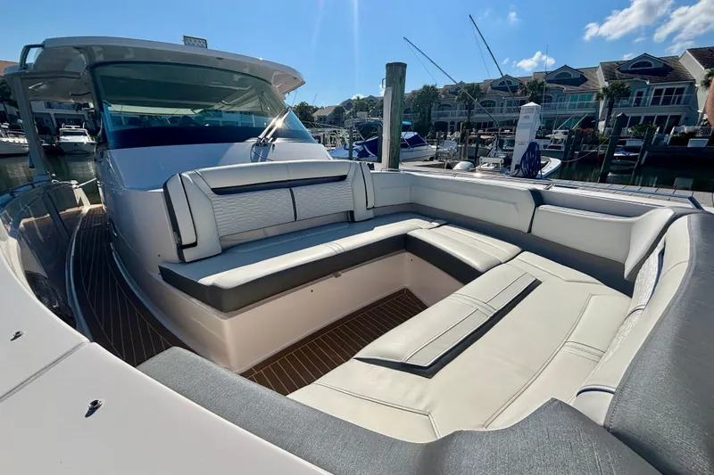  Yacht Photos Pics 2019 Tiara Sport 38 LS luxury yacht with spacious seating in a marina setting.