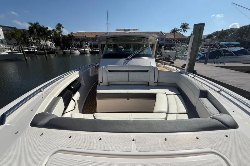  Yacht Photos Pics 2019 Tiara Sport 38 LS boat with spacious seating at a marina dock.