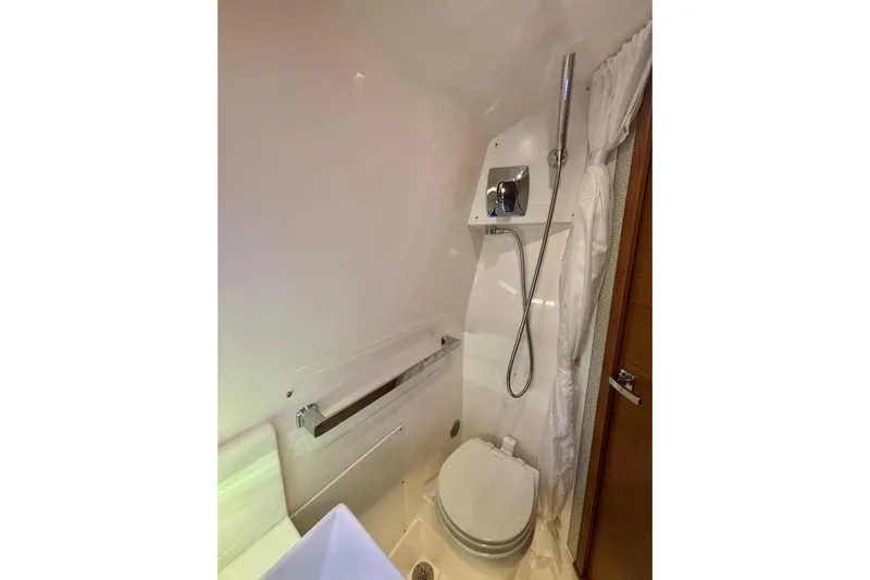  Yacht Photos Pics 2019 Tiara Sport 38 LS boat bathroom with shower and toilet.