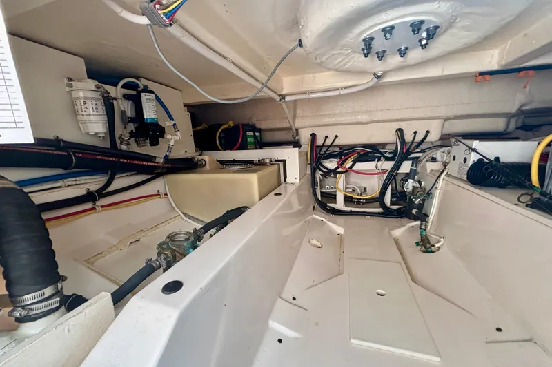  Yacht Photos Pics Engine compartment of a 2019 Tiara Sport 38 LS boat, showcasing wiring and components.
