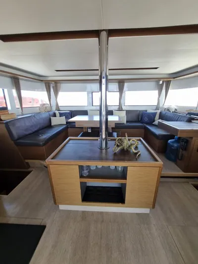  Yacht Photos Pics Interior of 2020 Lagoon 50 yacht with modern seating and wooden finishes.