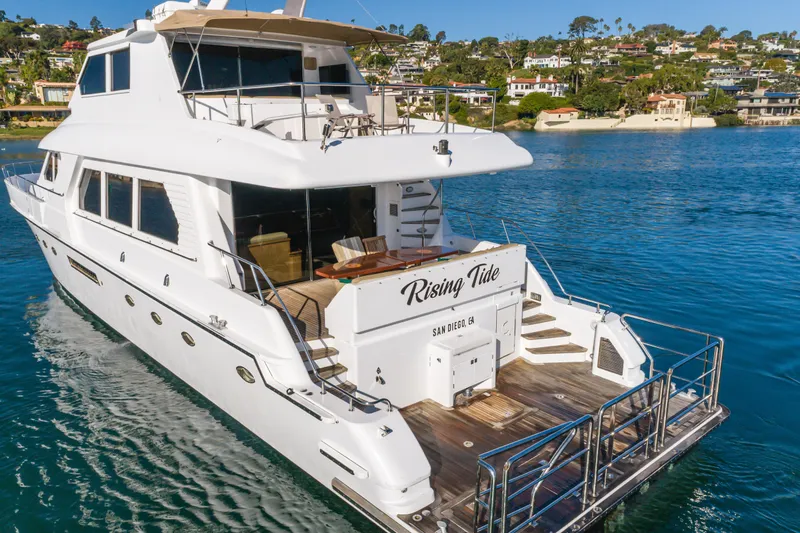 Rising Tide Yacht Photos Pics Luxury 1997 Forbes Cooper Pilothouse yacht "Rising Tide" on serene water near San Diego.