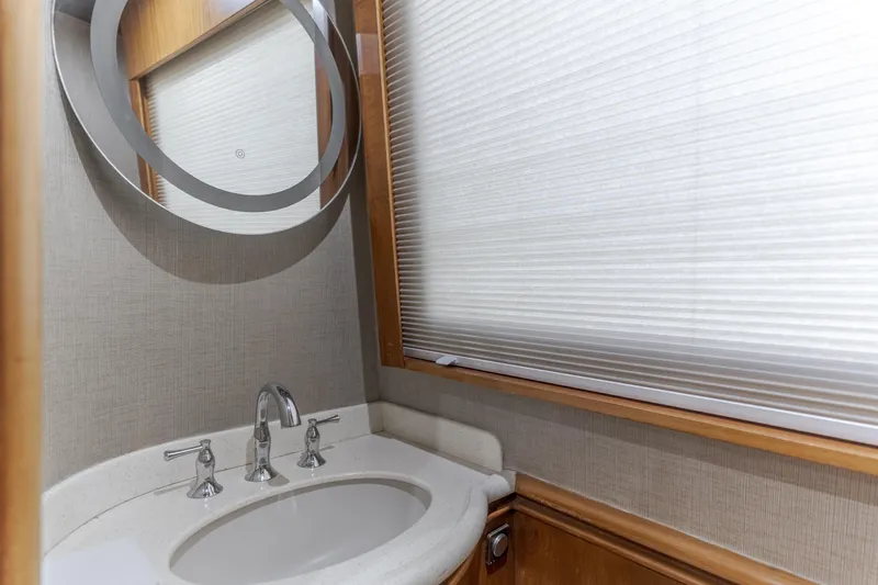 Rising Tide Yacht Photos Pics 1997 Forbes Cooper Pilothouse bathroom with modern sink and circular mirror.