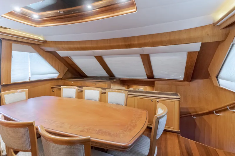 Rising Tide Yacht Photos Pics Luxurious dining area in 1997 Forbes Cooper Pilothouse yacht with wooden interior.