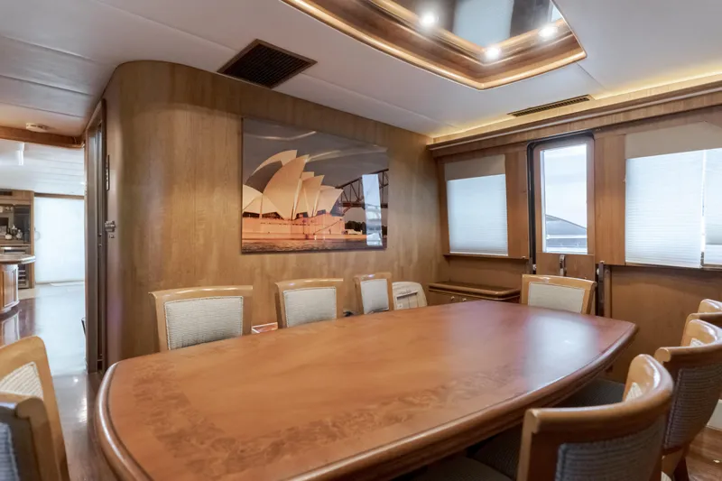 Rising Tide Yacht Photos Pics Luxurious dining area on 1997 Forbes Cooper Pilothouse yacht with elegant wood finishes.