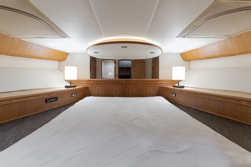 Rising Tide Yacht Photos Pics Luxurious 1997 Forbes Cooper Pilothouse yacht interior with elegant wood finish and ambient lighting.