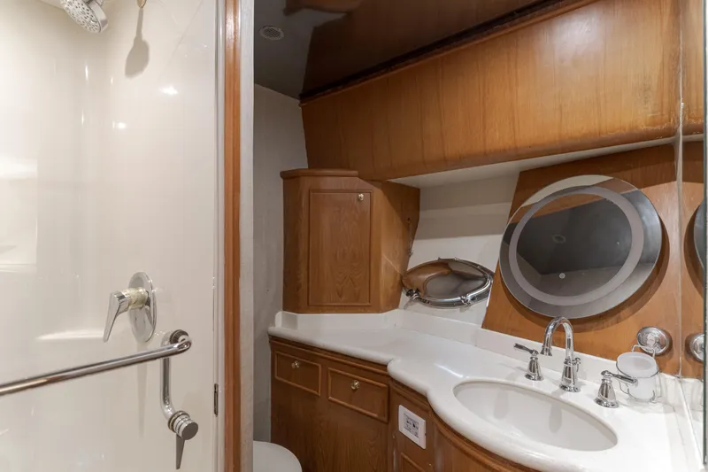 Rising Tide Yacht Photos Pics Luxurious 1997 Forbes Cooper Pilothouse yacht bathroom with wood cabinetry and modern fixtures.