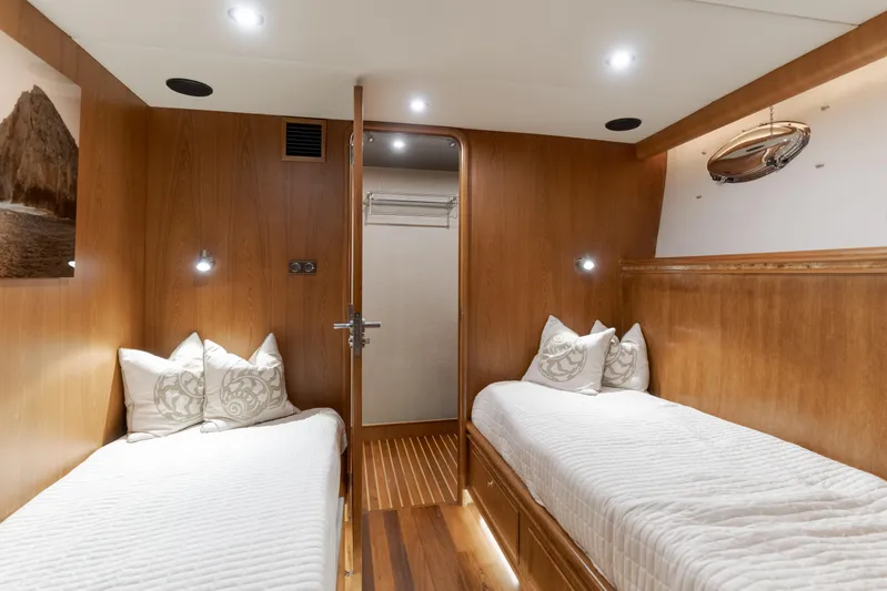 Rising Tide Yacht Photos Pics Luxurious 1997 Forbes Cooper Pilothouse cabin with twin beds and elegant wood paneling.