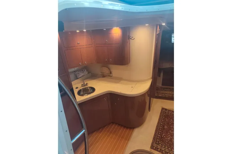  Yacht Photos Pics Luxurious 2007 Regal Commodore 4060 yacht interior with elegant wood cabinetry and modern amenities.