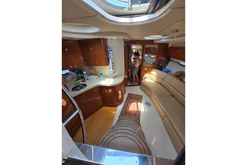  Yacht Photos Pics Luxurious interior of 2007 Regal Commodore 4060 yacht with elegant wood finishes and seating.