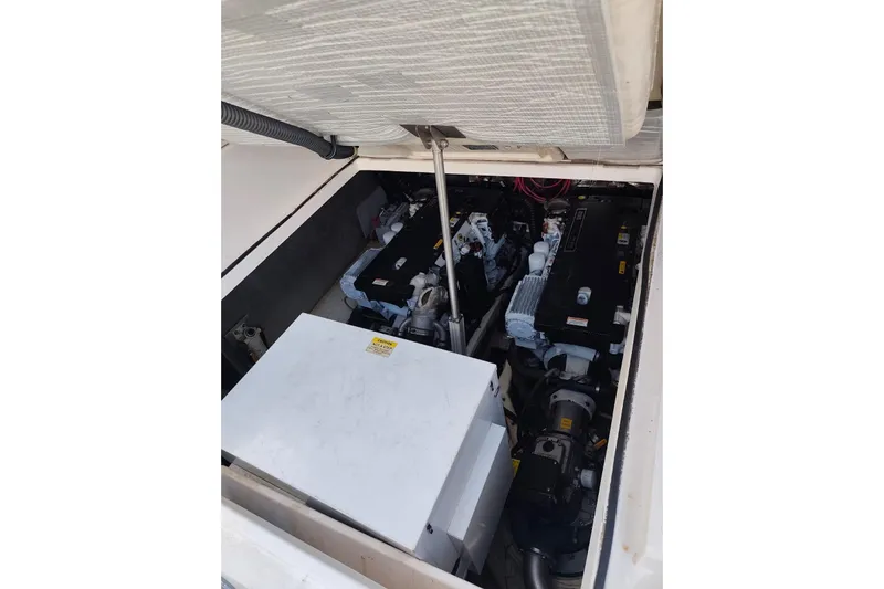  Yacht Photos Pics Engine compartment of 2007 Regal Commodore 4060 boat, showcasing dual engines and components.