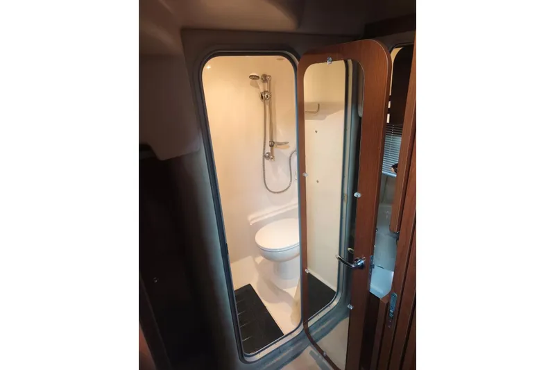  Yacht Photos Pics Bathroom interior of 2007 Regal Commodore 4060 yacht, featuring shower and toilet.