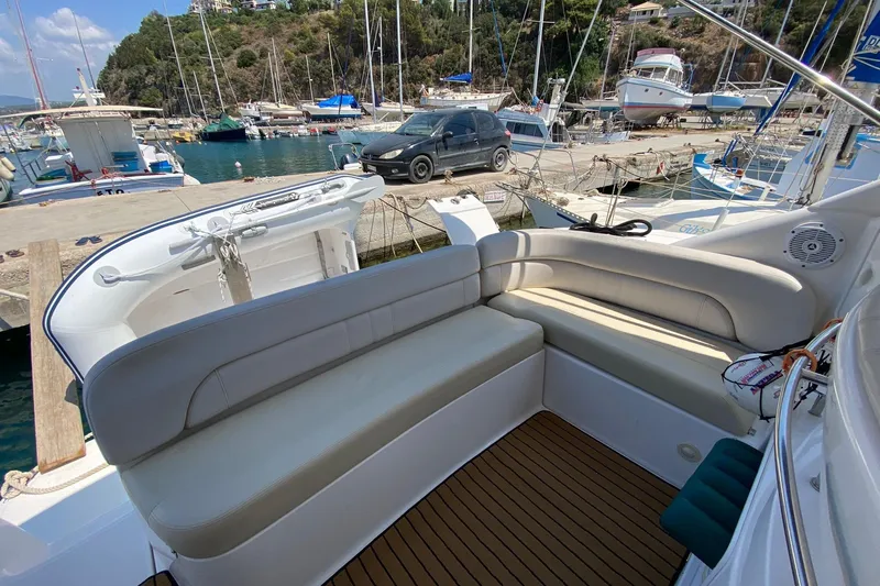  Yacht Photos Pics 2007 Regal Commodore 4060 yacht interior with seating, docked at a marina.