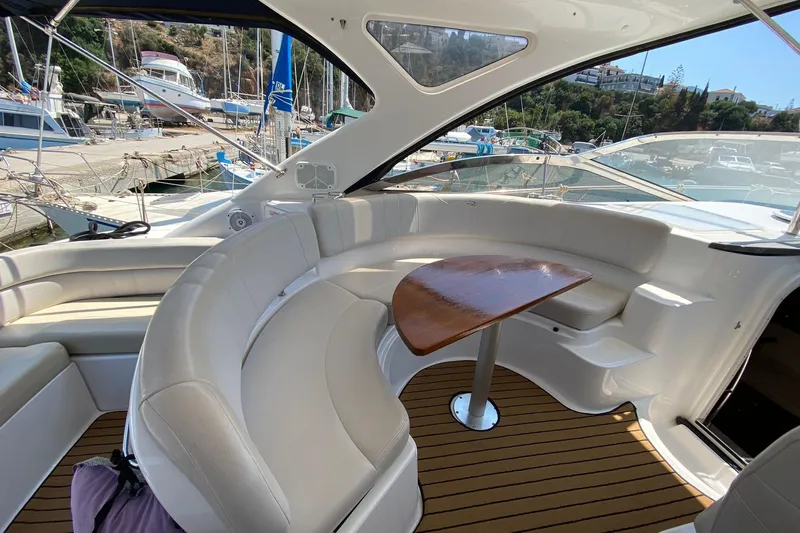  Yacht Photos Pics Luxurious 2007 Regal Commodore 4060 yacht interior with elegant seating and wooden table.